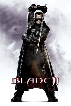 A man in a long leather coat holding a sword upright in front of him, grey smoke behind.
