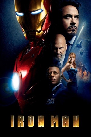 Robert Downey Jr in the red and gold Iron Man armour, helmet off, standing over a burning desert.