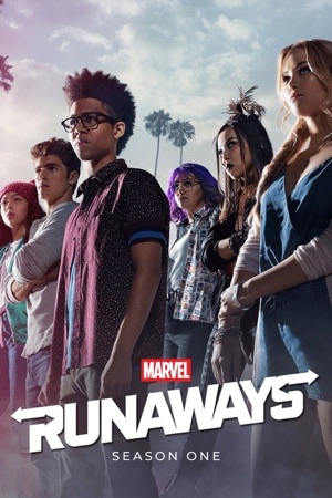 Six teenagers standing in a line against a pale sky and palm trees.